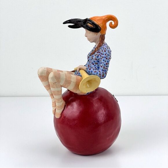 CARRIANNE L HENDRICKSON woman with beak hat sitting on apple sculpture 2… - Picture 3 of 16